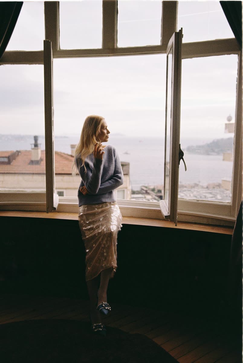 Kate at an open window over the Bosphorus
